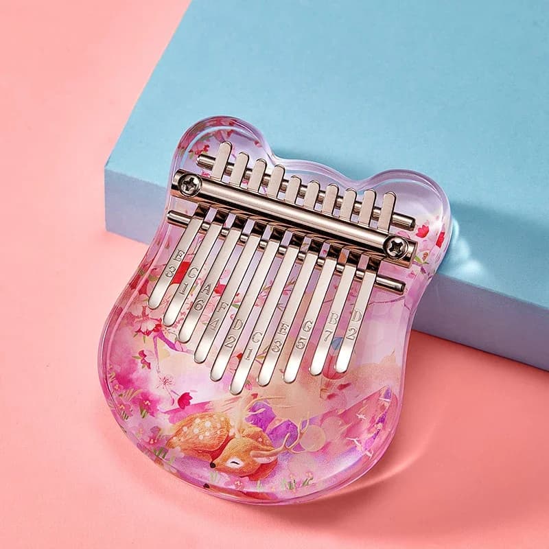 Kalimba 10 lames à corps acrylique rose pastel avec ses lames en acier