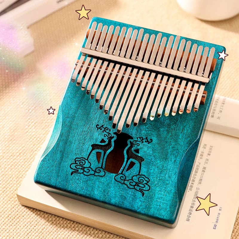 Kalimba 21 lames au corps turquoise décoré d'un motif de chat, lames en acier visibles
